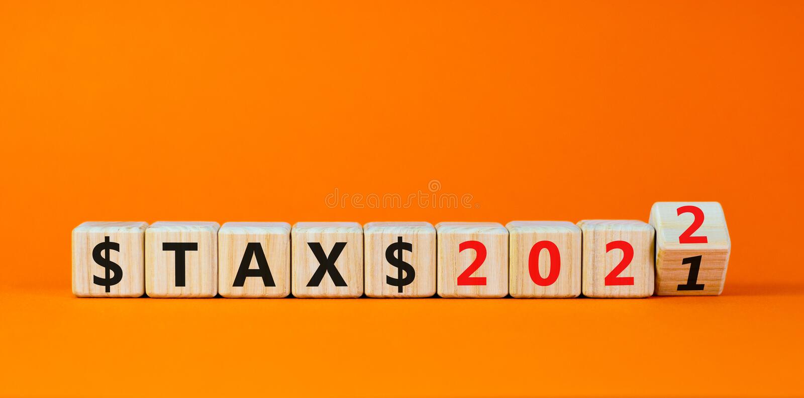 tax-new-year-symbol-turned-wooden-cube-changed-words-tax-to-tax-beautiful-orange-background-copy-s-tax-new-year-symbol-227179621